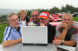 The lap top gets CBeebies!   Prior's seen it before, Liz is bemused